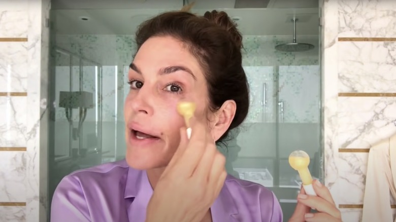 Cindy Crawford using skincare products