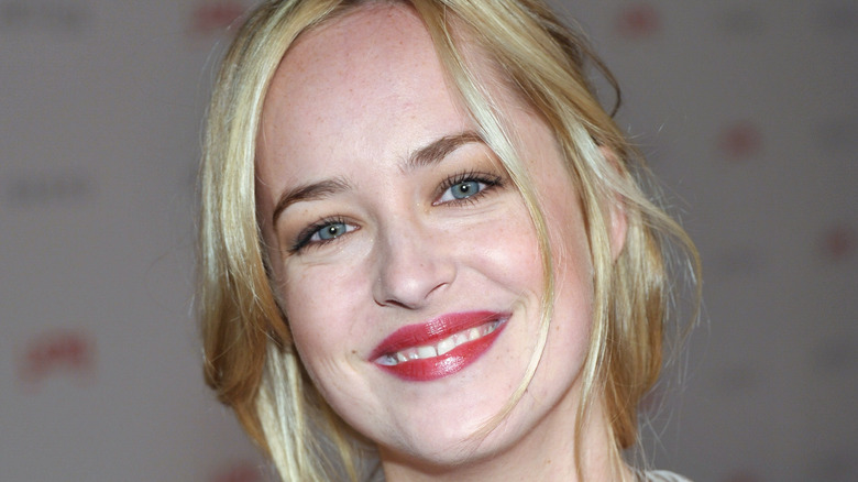 A younger, blonde Dakota Johnson