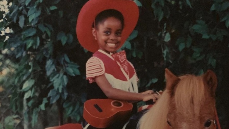 Young Denée Benton dressed as cowgirl