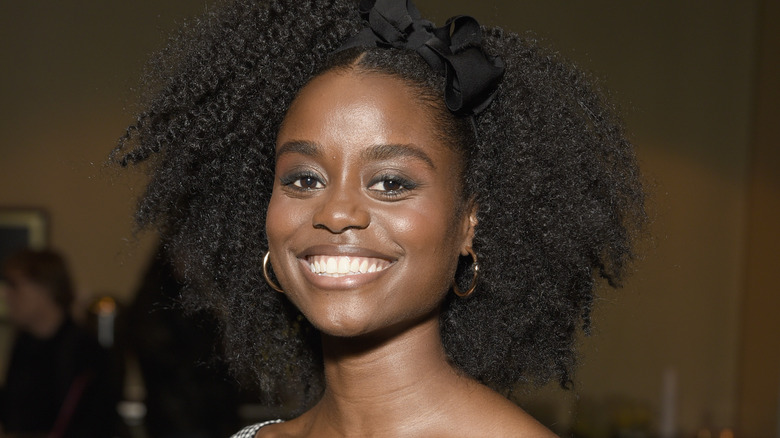 Denée Benton smiling, wearing hoops