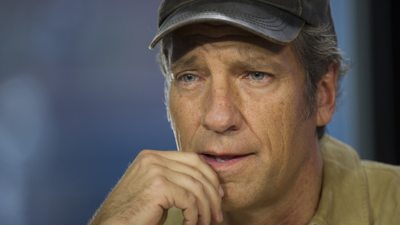 Mike Rowe wearing a baseball cap