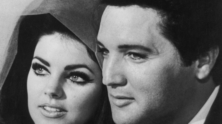 Priscilla Presley and Elvis Presley smiling