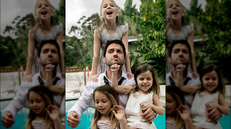 Dominic Zamprogna playing with his daughters