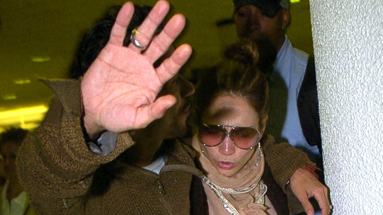 Jennifer Lopez followed by paparazzi