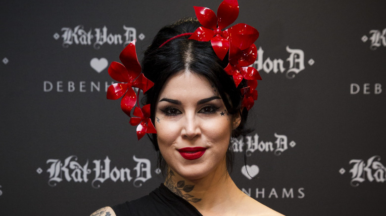 Kat Von D posing with a headress