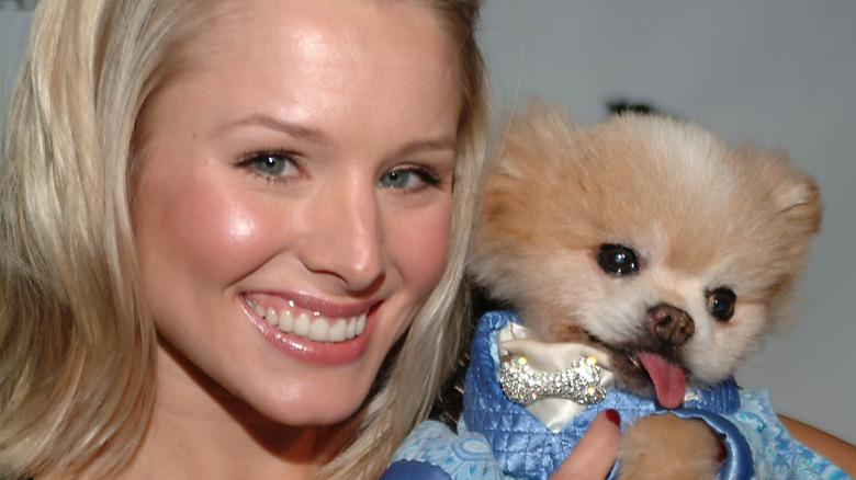 Kristen Bell holding a dog