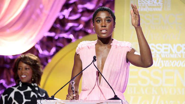 Lashana Lynch giving a speech