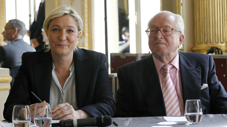 Marine Le Pen and Jean-Marie Le Pen smiling