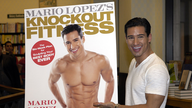 Mario Lopez showing off his book