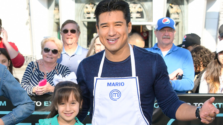 Mario Lopez cooking with daughter