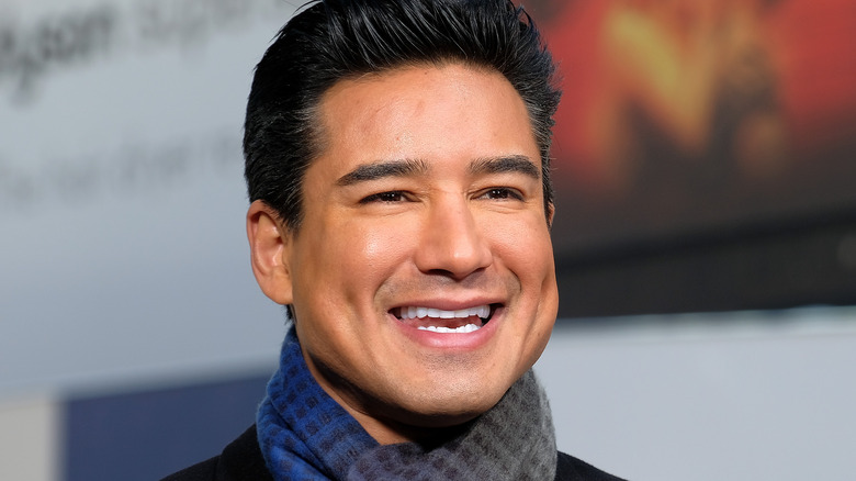 Mario Lopez wearing a scarf