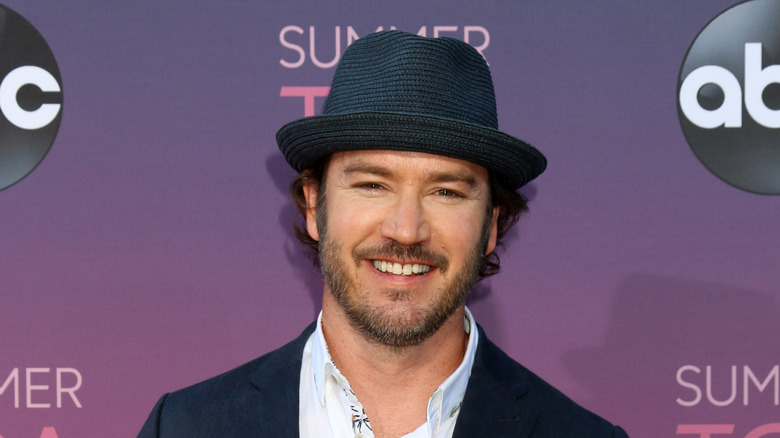 Mark-Paul Gosselaar wearing a hat