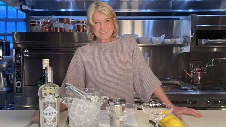 Martha Stewart smiling behind counter