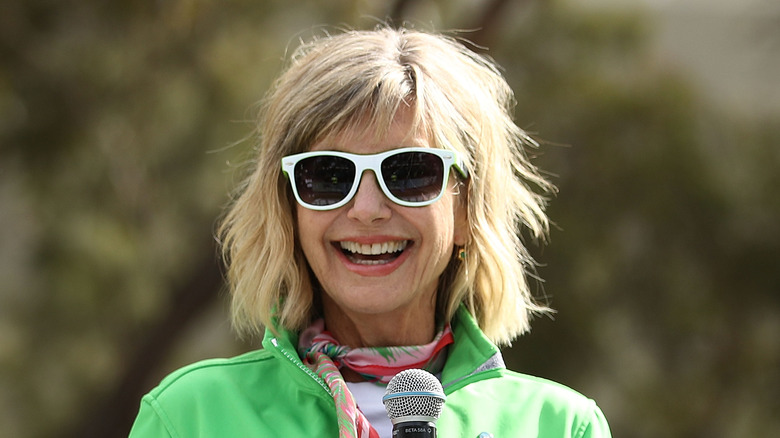 Olivia Newton-John in green jacket