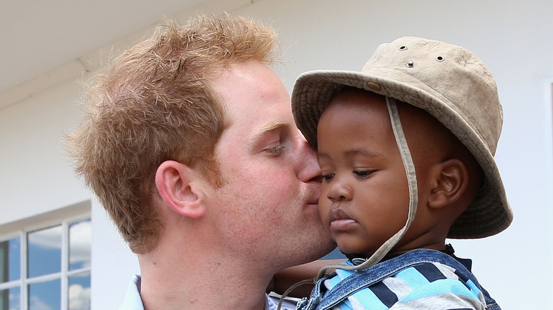 Prince Harry kissing baby