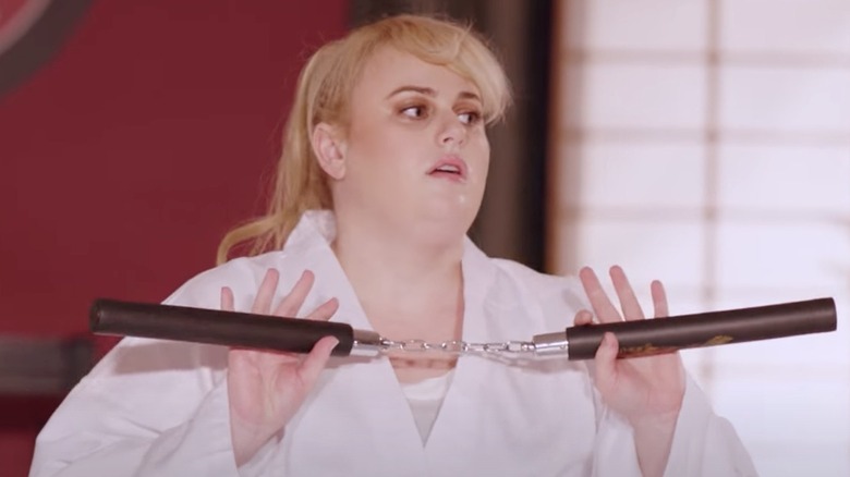 Rebel Wilson holding nunchucks