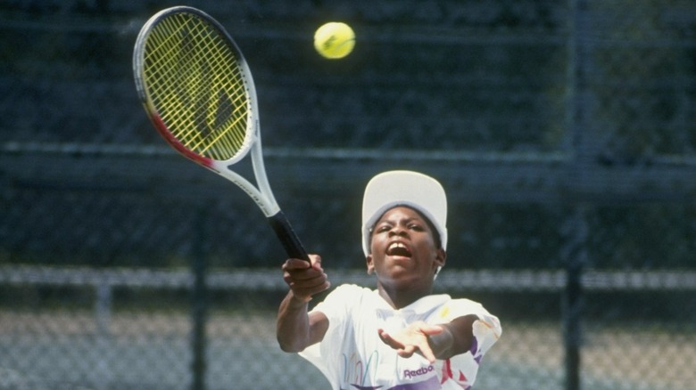 Young Serena Williams playing tennis