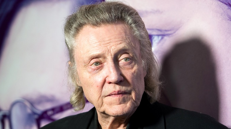 Christopher Walken smirks at camera