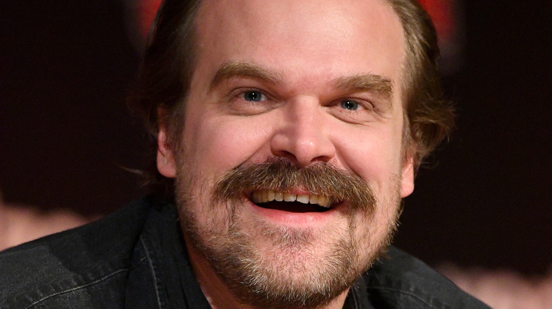 David Harbour smiles at camera