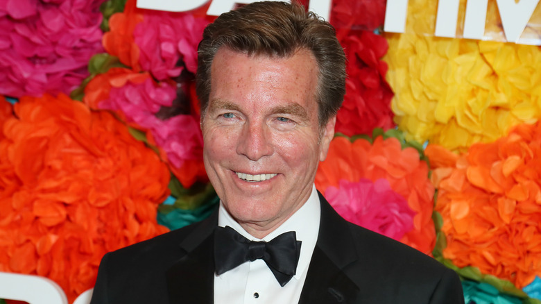 Peter Bergman in front of floral backdrop