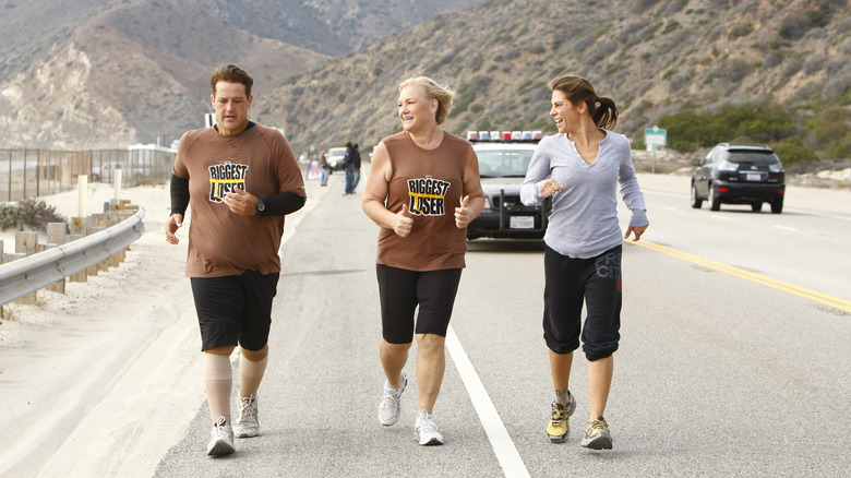 Jillian Michaels with contestants running on The Biggest Loser