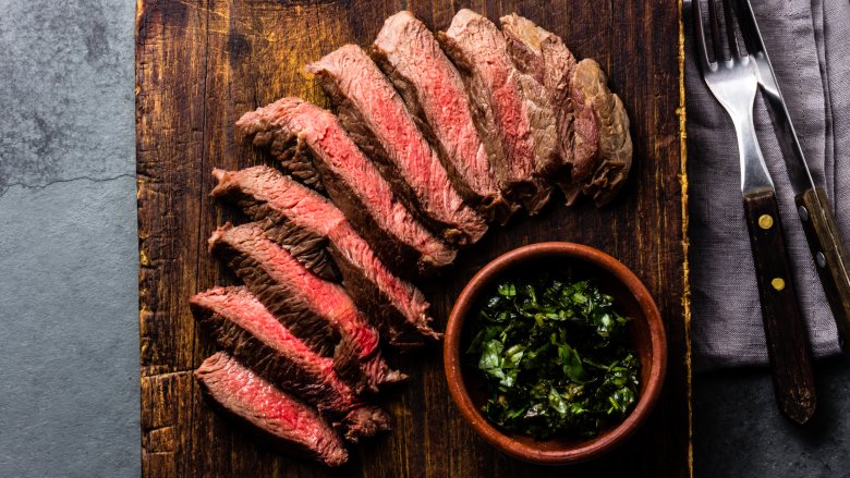 sliced steak with herbs