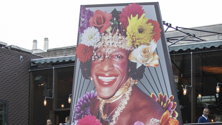 A sign depicting Marsha P. Johnson