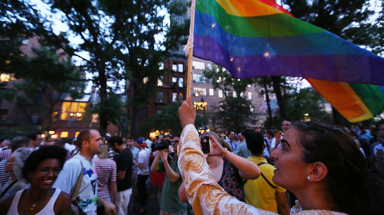 Person waving pride flag