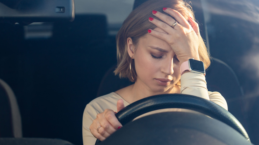 worried woman driving