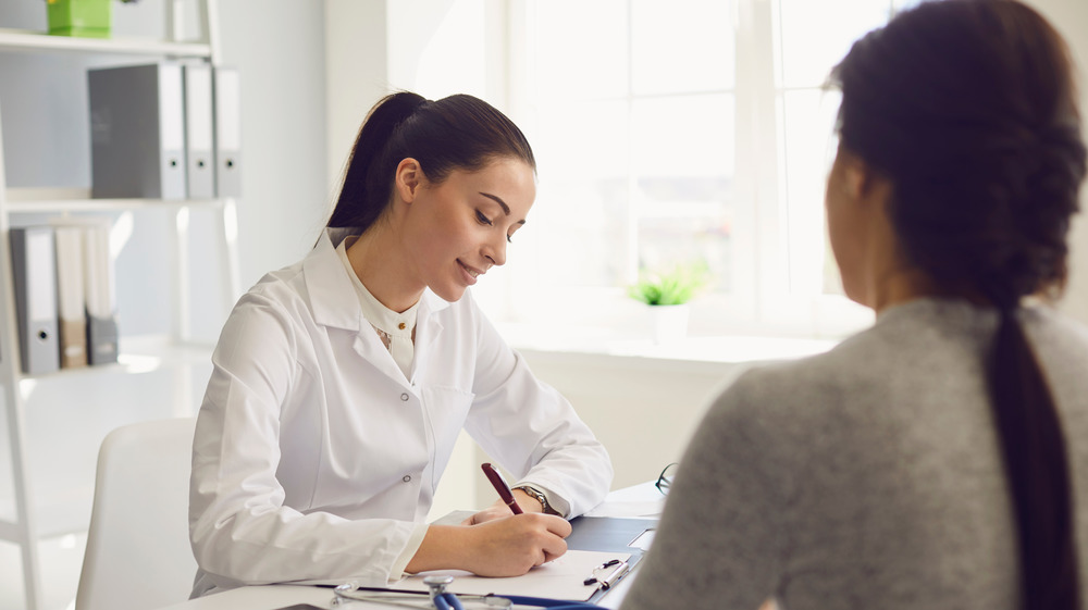 Patient consulting with doctor