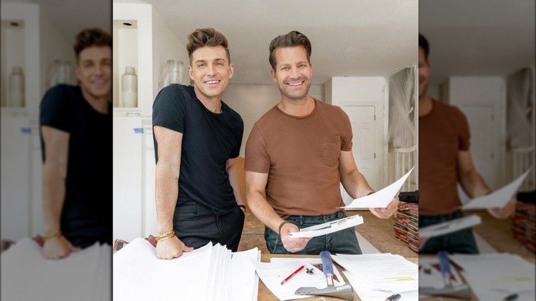 Berkus and Brent smiling while working