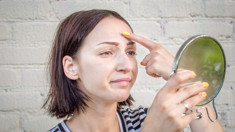 woman with acne