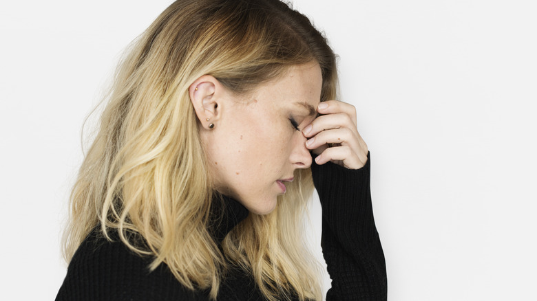 stressed woman with acne