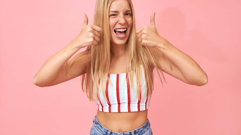 Crop top and belly button piercing