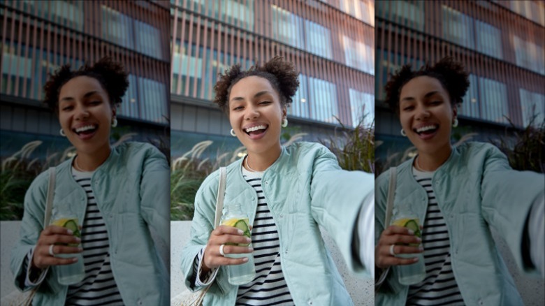 Smiling woman taking selfie