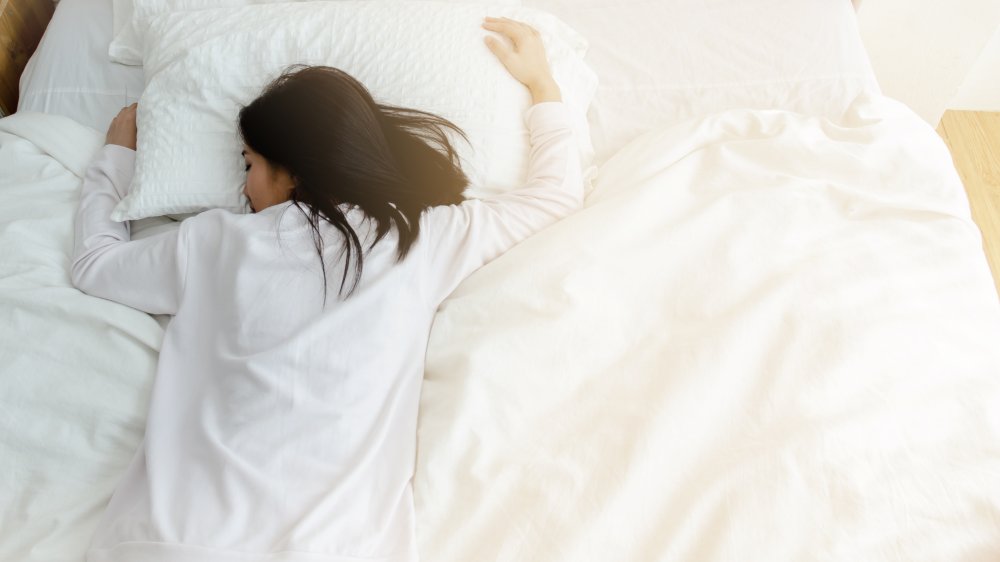 Woman sleeping on stomach