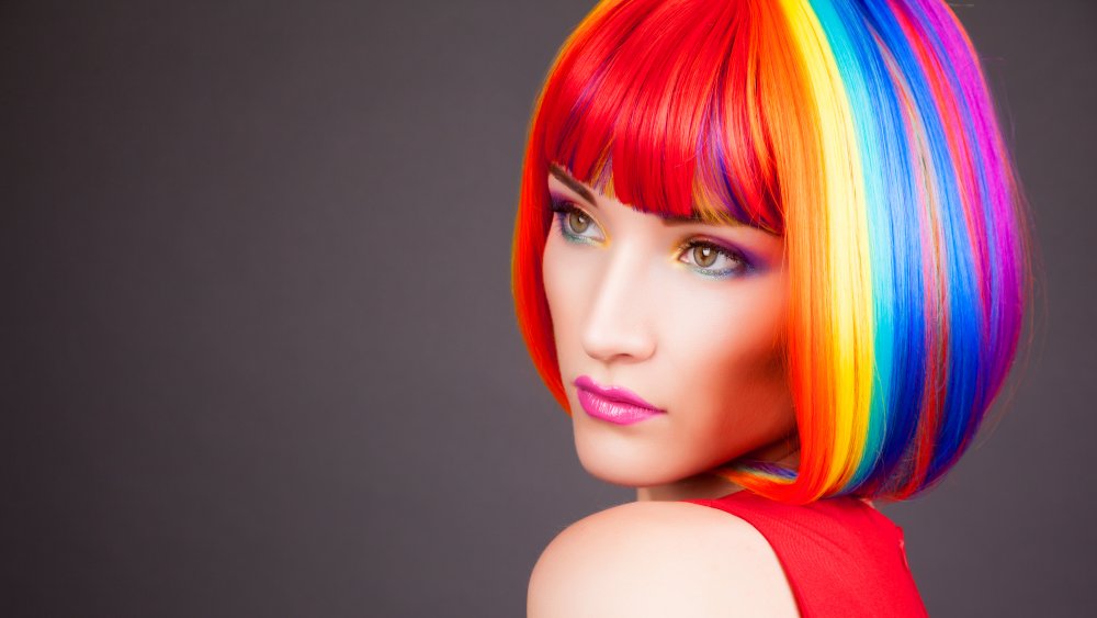 A woman with rainbow colored hair