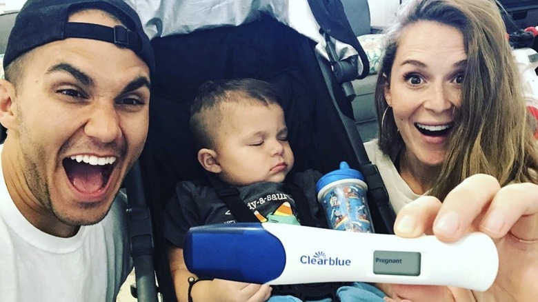 Carlos PenaVega, Ocean PenaVega, and Alexa PenaVega with her pregnancy test