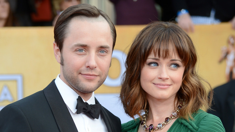 Alexis Bledel smiling at Vincent Kartheiser at the 2013 Annual Screen Actors Guild Awards