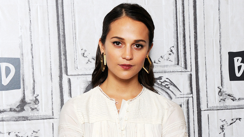 Alicia Vikander wearing a white blouse at Build