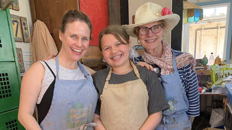 Andrea Barber smiling for a photo with her family