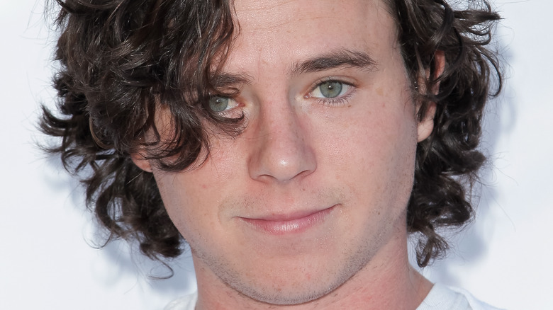 Charlie McDermott smirking