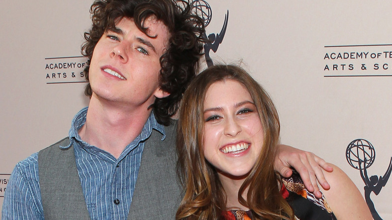 Charlie McDermott posing with Eden Sher