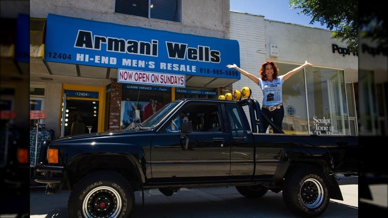 Claudia Wells standing by Armani Wells 