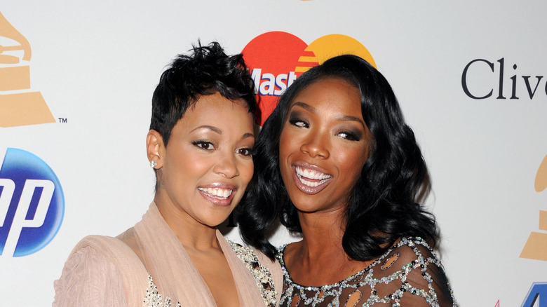 Brandy and Monica smiling at event