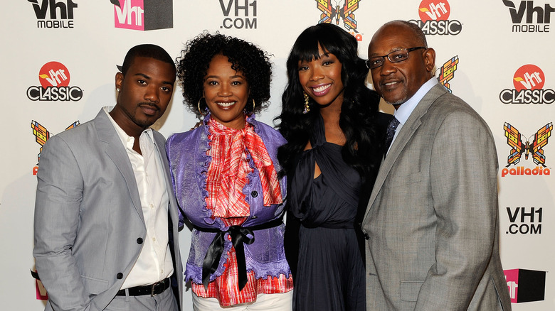 Brandy smiling with her family