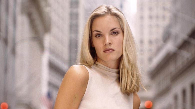 Bridgette Wilson-Sampras posing in front of tall buildings