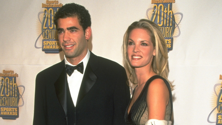 Pete Sampras posing in a tuxedo and Bridgette Wilson-Sampras in an evening gown at Sports Illustrated award gala