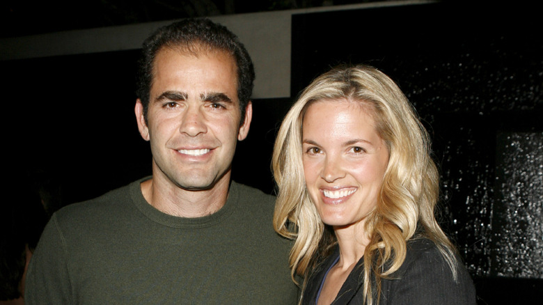 Pete Sampras standing next to wife Bridgette Wilson-Sampras