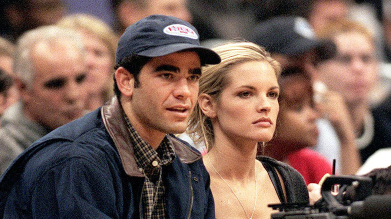 Pete Sampras and Bridgette Wilson-Sampras sitting together in 1999